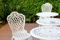 white chairs and table in lawn of garden Royalty Free Stock Photo