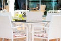 White Chairs And Table In Restaurant Royalty Free Stock Photo