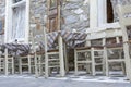 White chairs and white tables in traditonal greek style Royalty Free Stock Photo