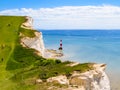 White chalk cliffs and Beachy Head Lighthouse, Eastbourne, East Sussex, England Royalty Free Stock Photo