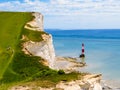 White chalk cliffs and Beachy Head Lighthouse, Eastbourne, East Sussex, England Royalty Free Stock Photo