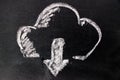 White chalk drawing as cloud and down arrow icon on black board