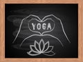 White chalk drawing of hands making a heart shape on school blackboard flat design. Love yoga concept. Royalty Free Stock Photo