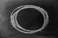 White chalk hand drawing as circle shape on blackboard or chalkboard background Royalty Free Stock Photo