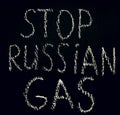 White chalk inscription of words on black board stop Russian gas