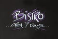 White chalk sign writing reading "Bistro open 7 days" Royalty Free Stock Photo