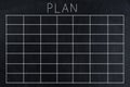 White chalk sketch of blank monthly grid timetable schedule on black chalkboard Royalty Free Stock Photo