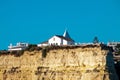 White chapel over a cliff against blue cloudless sky Royalty Free Stock Photo