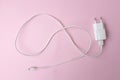 White Charger Adapter color white on pink Background