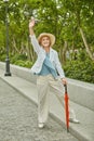 White cheerful elderly woman is travelling