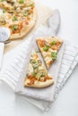 White cheese pizza with artichoke and arugula