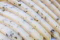 White Cheese with spices and sliced bits close-up Royalty Free Stock Photo