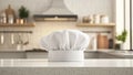 White chef's hat on a kitchen counter (1 Royalty Free Stock Photo