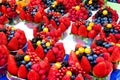 White cherries,strawberries,raspberries,blueberries and other different fruits and berries on the counter for sale.Healthy Eating Royalty Free Stock Photo