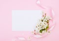 White cherry flowers on pink background,  empty white card.  Creative layout , spring template  . Spring background with empty Royalty Free Stock Photo