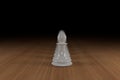 White chess pawn line on a wooden surface Royalty Free Stock Photo