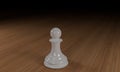 White chess pawn on a wooden surface Royalty Free Stock Photo