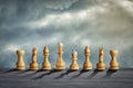 White chess pieces, against the background of the cloudy sky. The concept of a strategy game, business. Abstraction. Business, Royalty Free Stock Photo