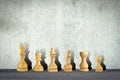 White chess pieces on the background of a concrete wall. Copy space. Strategy. Sport Royalty Free Stock Photo