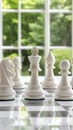 White chess pieces are meticulously positioned on a chessboard in a contemporary office environment, creating a focused Royalty Free Stock Photo