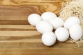 White chicken eggs and broken eggs on wooden board or table. Royalty Free Stock Photo