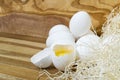 White chicken eggs and broken eggs on wooden board or table Royalty Free Stock Photo