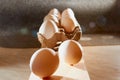 White chicken eggs in cardboard on wooden surface with interesting light. The concept of taking pictures of food. Fresh eggs from Royalty Free Stock Photo