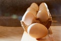 White chicken eggs in cardboard on wooden surface with interesting light. The concept of taking pictures of food. Fresh eggs from Royalty Free Stock Photo