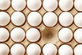 White chicken eggs in the cell egg tray. One chicken egg in a cardboard box is missing. Royalty Free Stock Photo