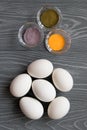 White chicken eggs and color dyes on a gray table. Celebrating E Royalty Free Stock Photo