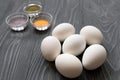 White chicken eggs and color dyes on a gray table. Celebrating E Royalty Free Stock Photo