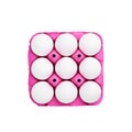 White chicken eggs in a pink carton tray box on isolated white background Royalty Free Stock Photo