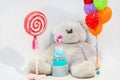 White children`s photozone with huge soft bear and balloons