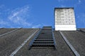 White chimney on grey roof without smoke