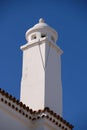 White chimney in Spain against blue sky Royalty Free Stock Photo