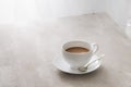 White china cup of tea with milk on a plain background Royalty Free Stock Photo