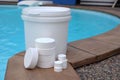 White chlorine tablets for swimming pool disinfection, pool water maintenance. Royalty Free Stock Photo