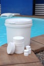 White chlorine tablets for swimming pool disinfection, pool water maintenance. Royalty Free Stock Photo