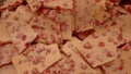 White chocolate bars with small strawberry pieces