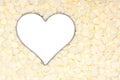 White chocolate morsels surround a silver heart Royalty Free Stock Photo