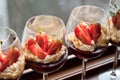 White chocolate mousse with coulis and strawberries