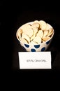 White chocolate spuds in a ceramic cup Royalty Free Stock Photo