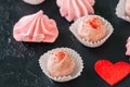 White chocolate and strawberry truffles and pink meringue kisses Royalty Free Stock Photo