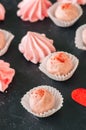 White chocolate strawberry truffles and pink meringue kisses on Royalty Free Stock Photo