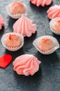 White chocolate strawberry truffles and pink meringue kisses on Royalty Free Stock Photo