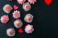White chocolate strawberry truffles and pink meringue kisses on Royalty Free Stock Photo