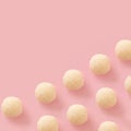 white chocolate balls on a soft pink background.flat lay cookies pattern idea.holidays valentine concept.aesthetic food design. Royalty Free Stock Photo