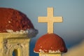 White Christian cross in front of a cloudy sky Royalty Free Stock Photo