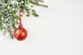 White Christmas background with fir tree and red decoration Royalty Free Stock Photo