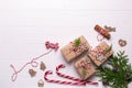 White christmas background. Framewith christmas gifts and candy cane, decorations , pine cones, fir branches